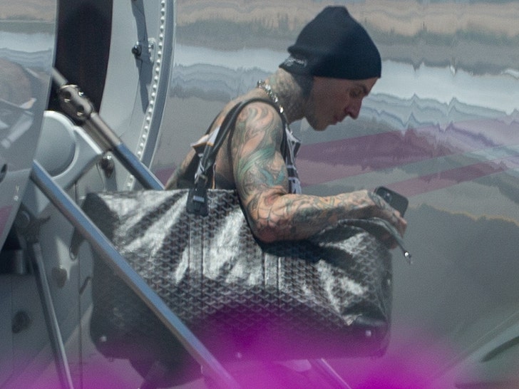 0814-travis barker plane ride gall launch bg