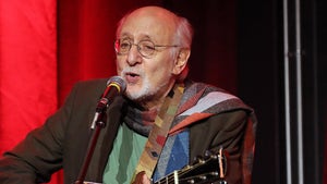 Peter Yarrow Singing And Playing a Guitar