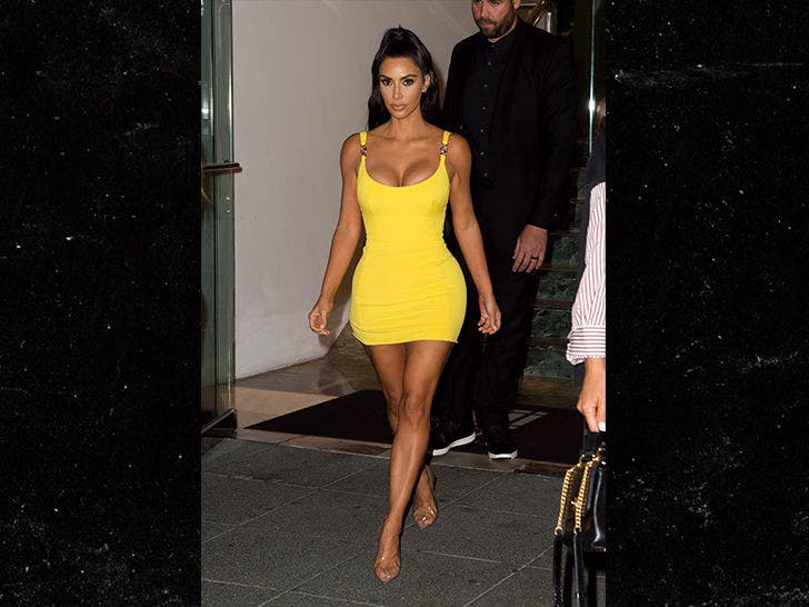 Kim Kardashian's Tight Yellow Dress, Long Braid & Hoops – Pics