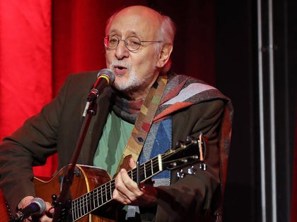 Peter Yarrow Singing And Playing a Guitar