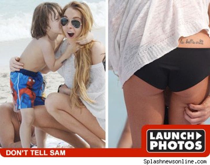 Lindsay Lohan -- Beach Babies and Back Tattoos :: 1231_lohan_photo_launch_08-1
