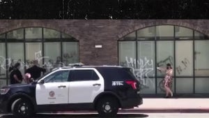 L.A. Cops Encourage White Lady Tagging Building, Tell Her to Spell 'Floyd'