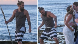 Jason Momoa Plays With Trident on a Beach in Hawaii, Photobombs Newlyweds