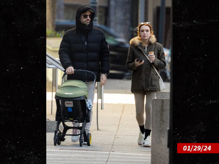 Lindsay Lohan Takes Baby on Stroll with Husband During Netflix Shoot