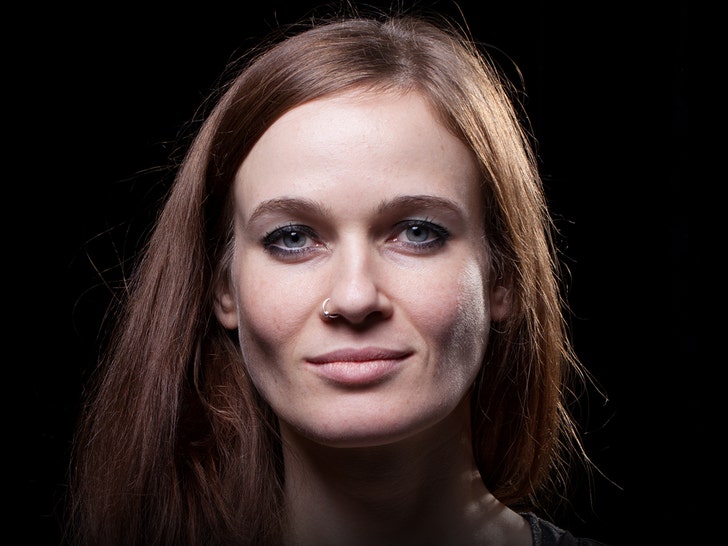 Anika Niles is seen posing for a headshot.
