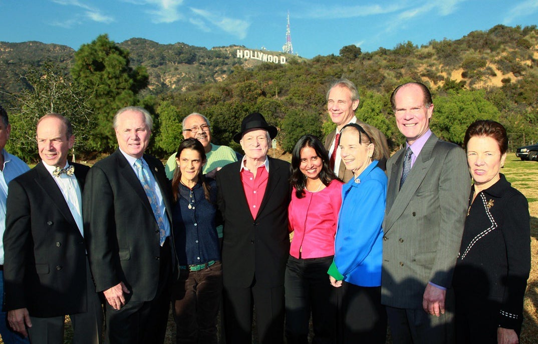 In 1978, Playboy's Hugh Hefner helped raise funds in efforts to restore the Hollywood Sign. This photo of him surrounded by Los Angeles council members and activists was taken in 2010.