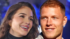 olivia culpo and christian mccaffrey smiling main getty