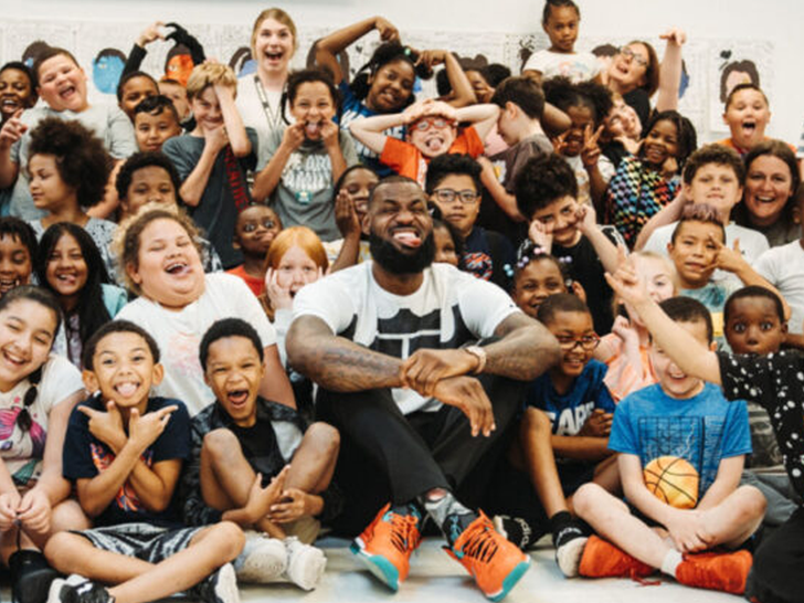 lebron james with kids at I PROMISE school