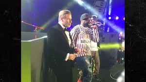 John Travolta Dances Onstage with 50 Cent at Cannes