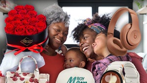 Mother Being Hugged By Her Family Surrounded By Gifts From Amazon
