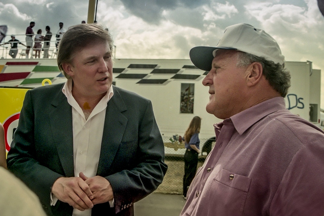 Donald Trump talks with IndyCar racing legend A.J. Foyt Jr. before the Indy 200 at Walt Disney World Speedway in Orlando, FL.