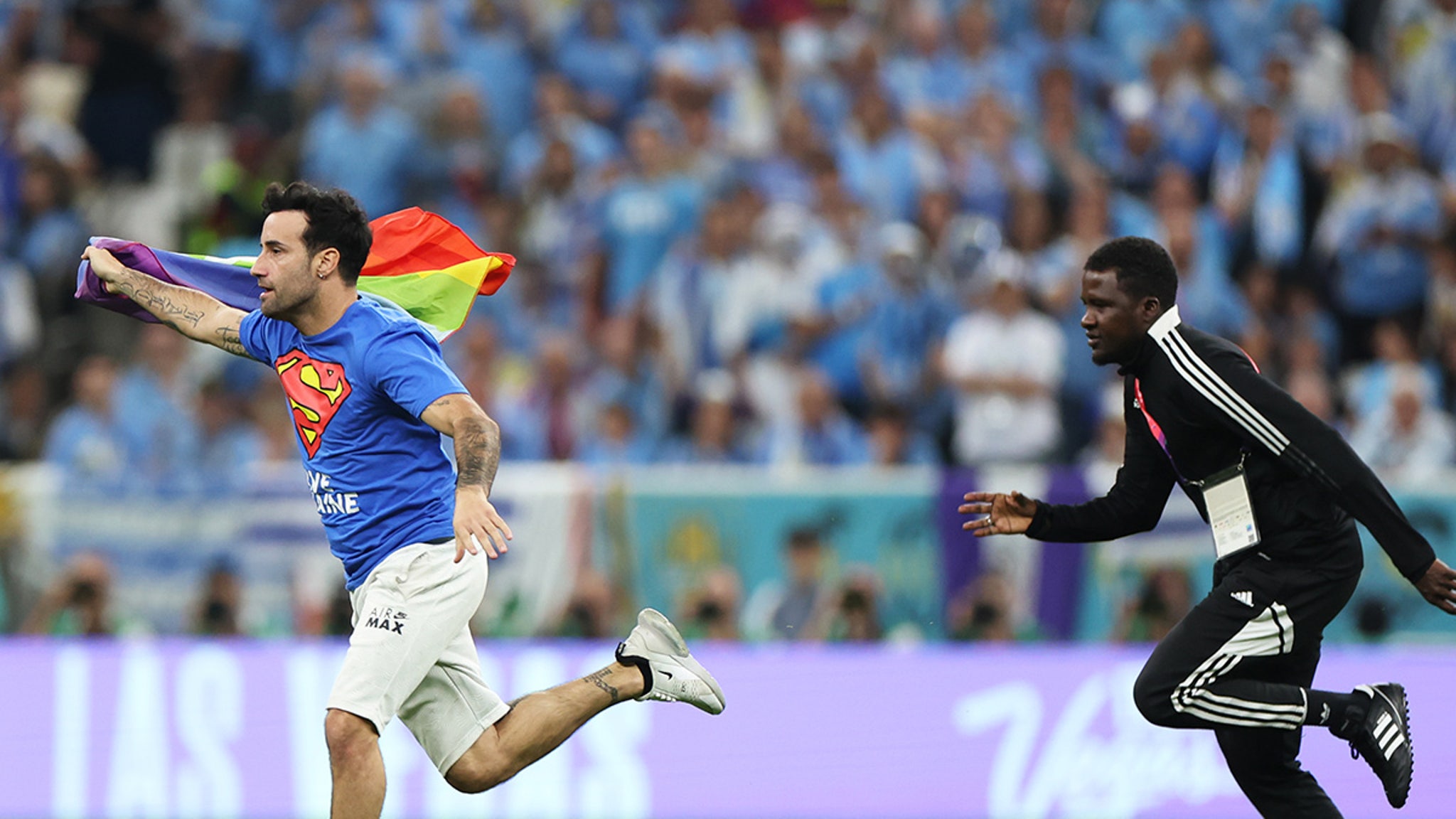 Protester with Rainbow Flag Storms Field during the World Cup match