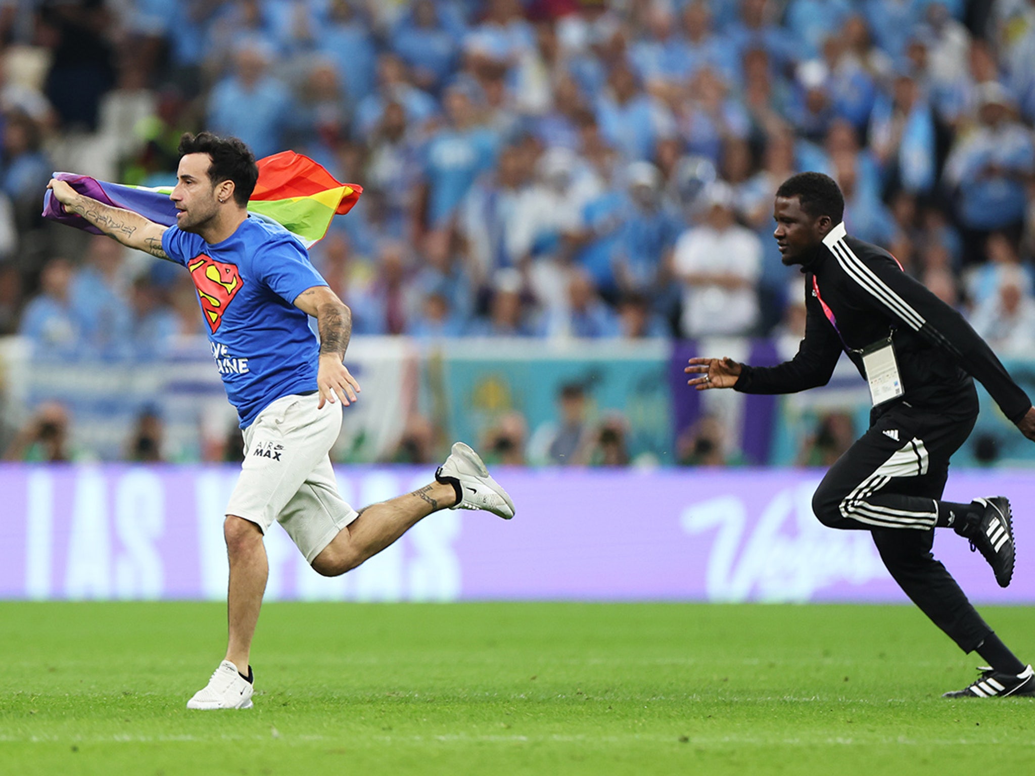 Protester with rainbow flag runs onto field at World Cup - The Athletic