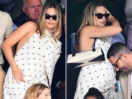 Margot Robbie Looking Pregnant In a White Dress