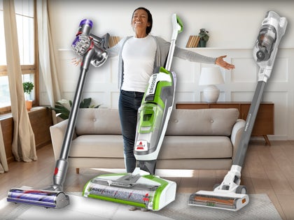 Happy Woman Surrounded By Vacuums Available On Amazon