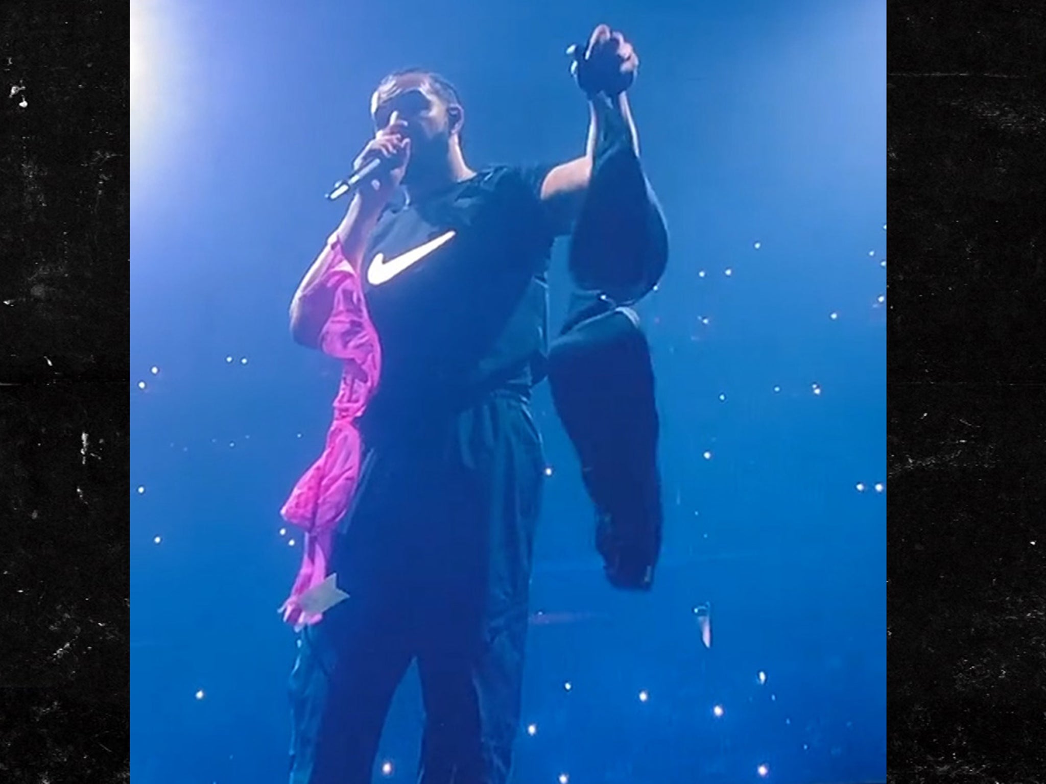 Drake stunned after a bigger 46G bra is thrown at him on stage 