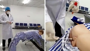 China's New Anal Swab COVID Testing Demonstrated on Dummy