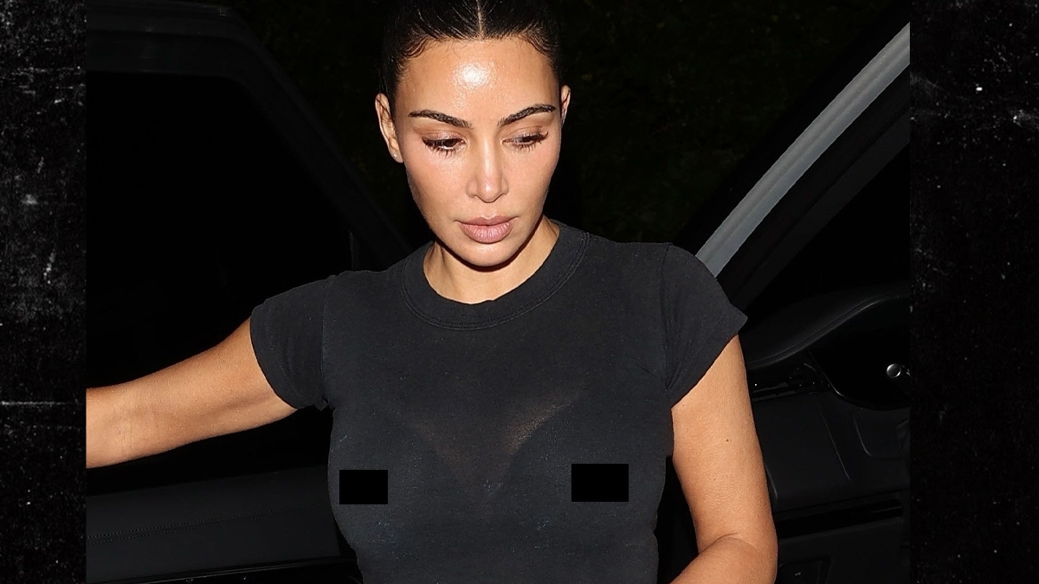 Kim Kardashian Reveals Possibly Pierced Nipples in Tight Black T-Shirt