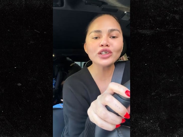 122225_chrissy_tiegen_tooth