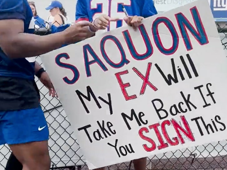 New York Giants running back Saquon Barkley (26) signs autographs