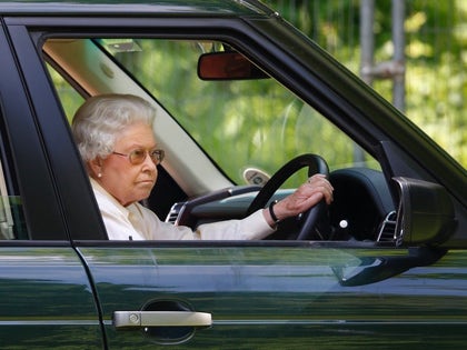 Queen Elizabeth Driving Behind The Wheel Car Photos 08