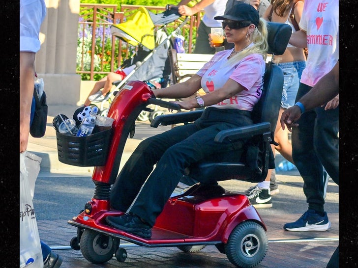 Christina Aguilera Rides Electric Wheelchair Around Disneyland Park