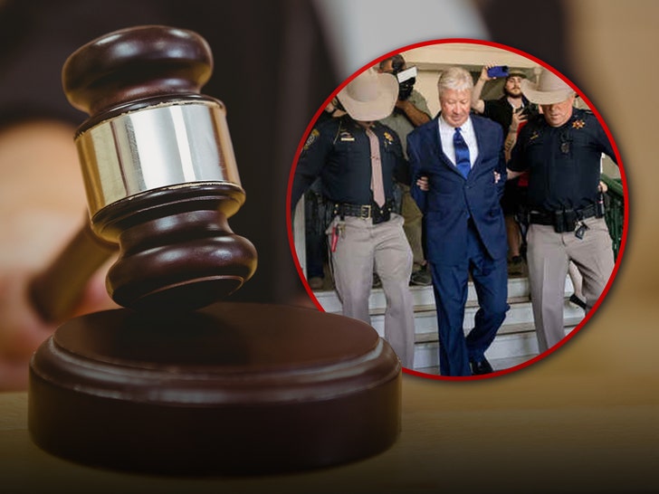 Robert Morris is seen being led down a set of stairs by a pair of police officers next to a gavel and block.