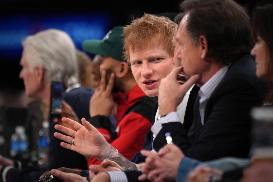 Ed Sheeran keeps it cool while sits courtside as the New York Knicks play the Los Angeles Clippers at Madison Square Garden on March 26, 2025 in New York City