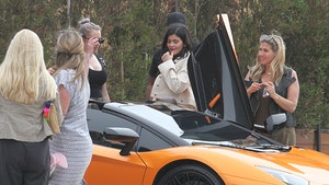 Kylie Jenner Leaves Lunch in Malibu in Orange Lambo