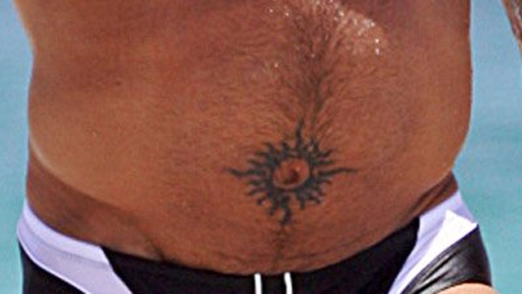 Belly button tattoo male