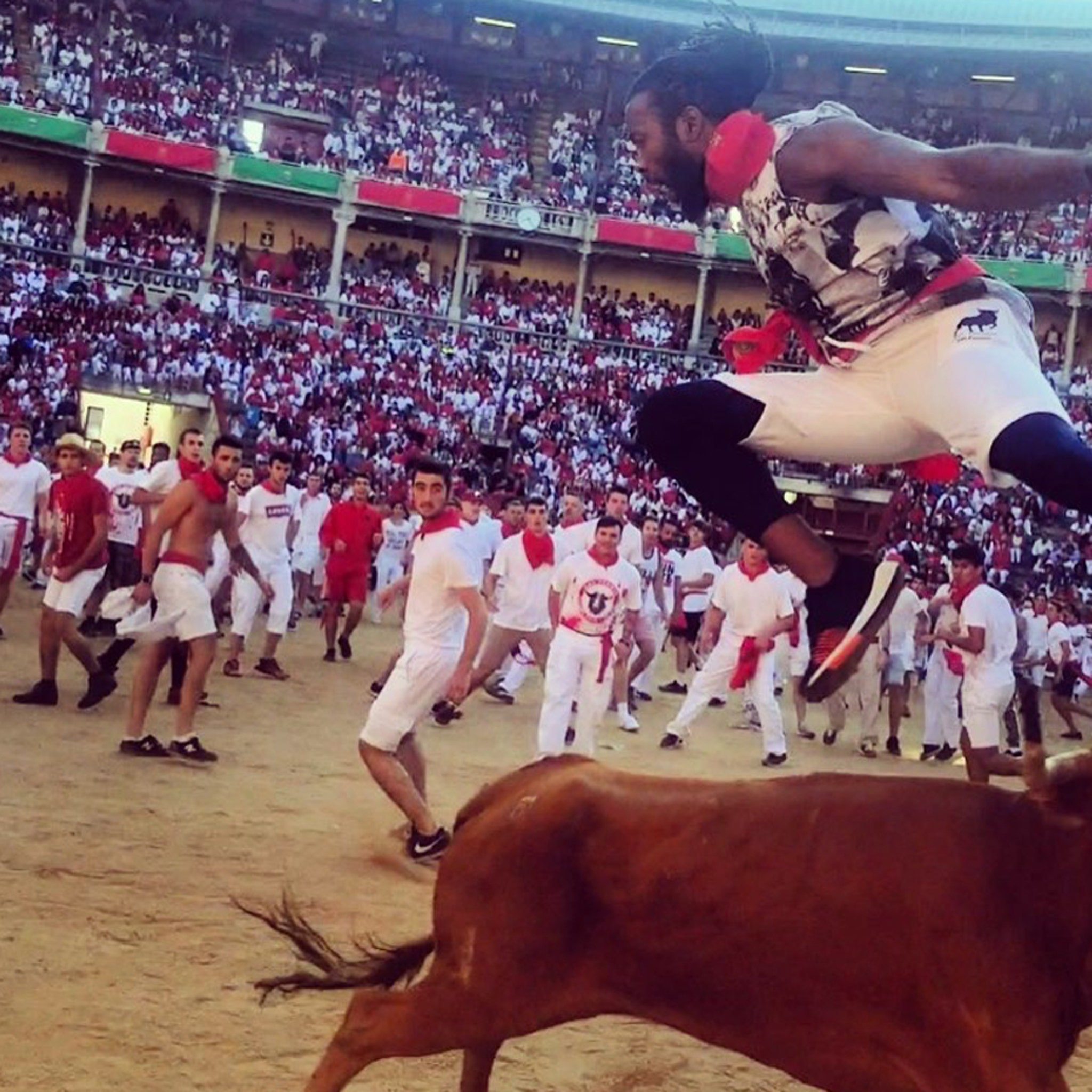 Redskins' Josh Norman leaps over bull in Pamplona, Spain - Sports  Illustrated