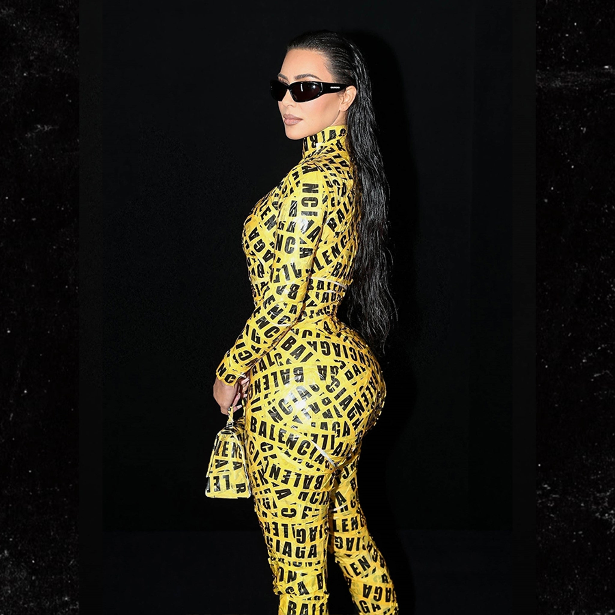 Kim Kardashian Sports Yellow Caution Tape for Balenciaga Show as