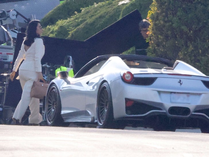 1024-Kim-Kardashian-Shooting-Alls-Fair-Ferrari-White-Suit-photos-primary-2