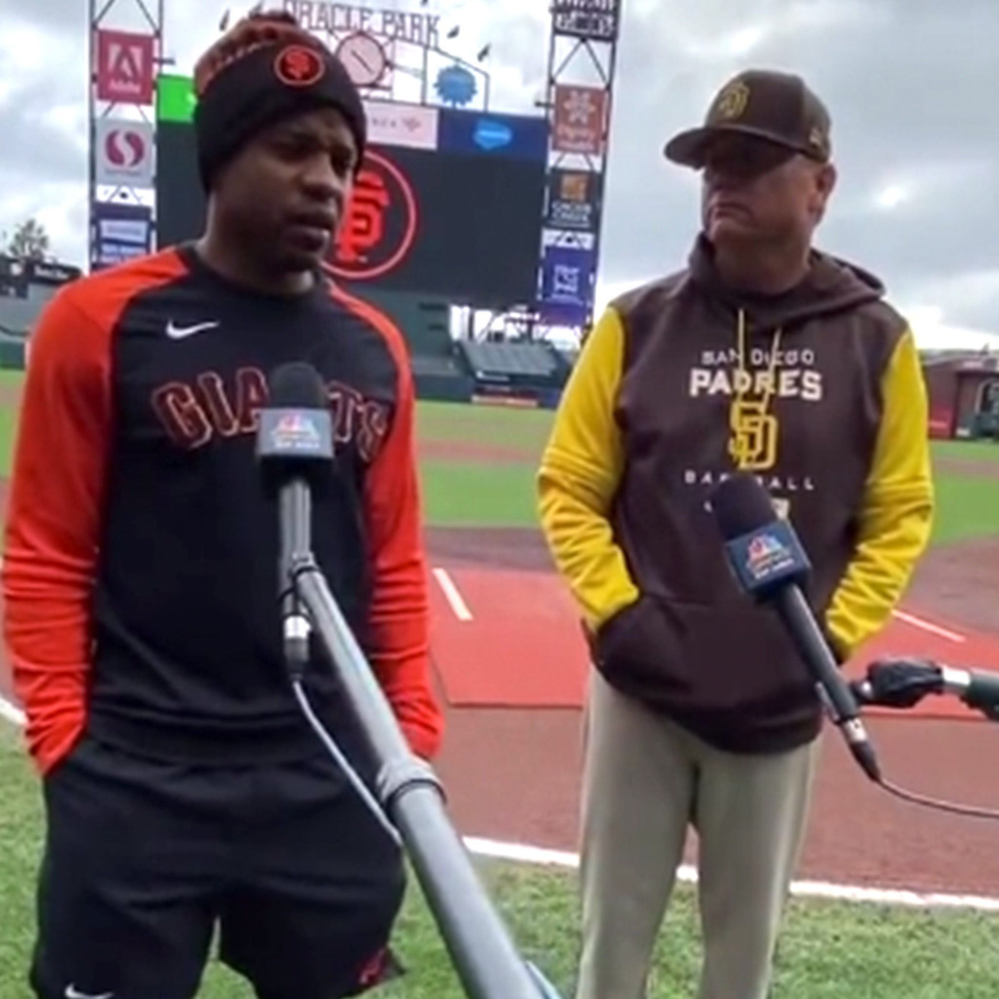 Giants first base coach Alyssa Nakken, right, chats with Mike News Photo  - Getty Images