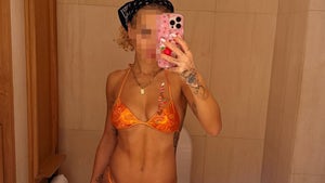 1104-Rita-Ora-Orange-Bikini-PRIMARY