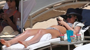 Jessica Alba Shows Off Baby Bump Sunbathing in Hawaii