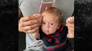 Enrique Iglesias Dances with His 2-Month-Old Daughter on His Lap