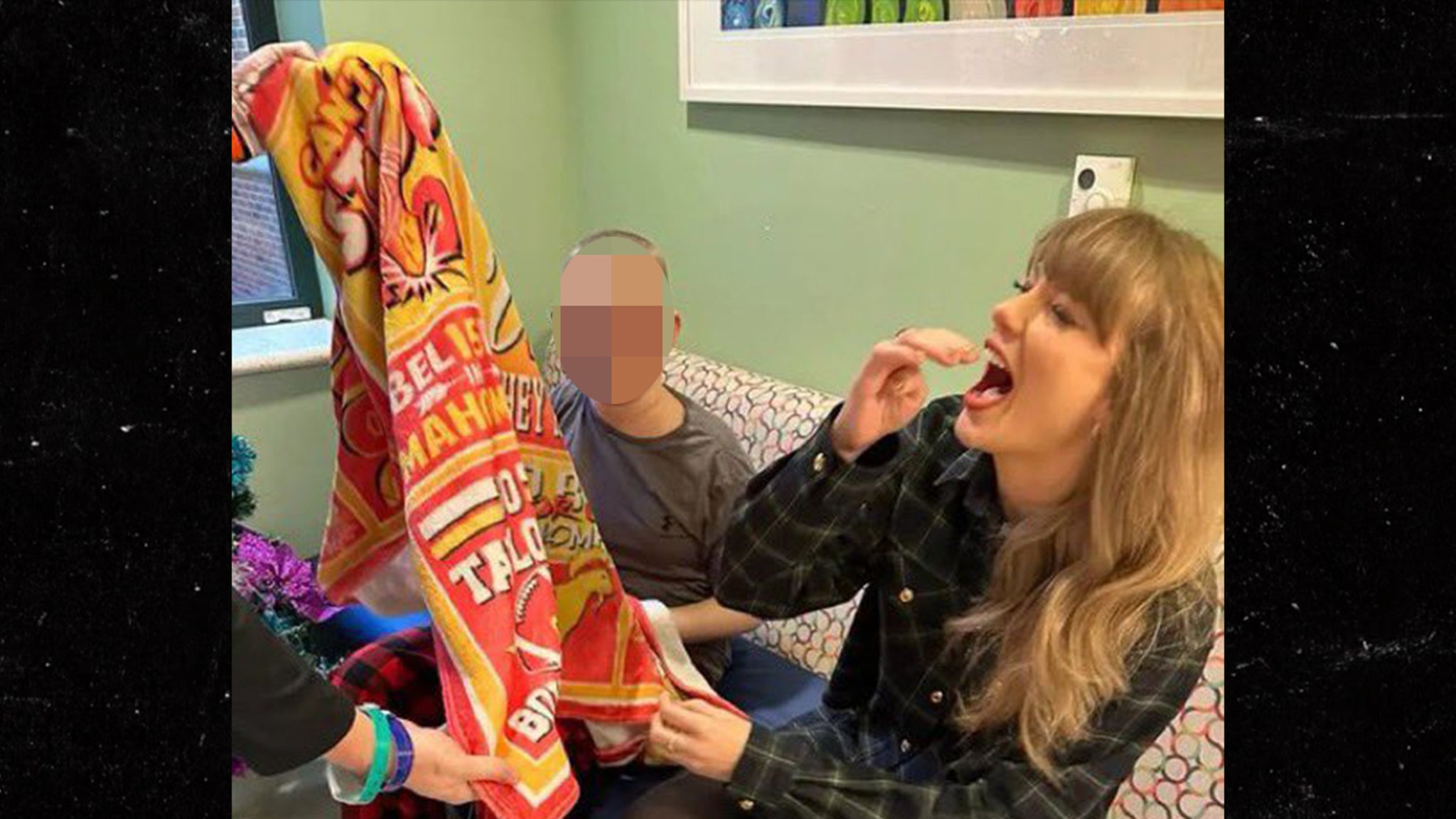 Taylor Swift Poses With Kid's Travis Kelce Blanket During Hospital Visit