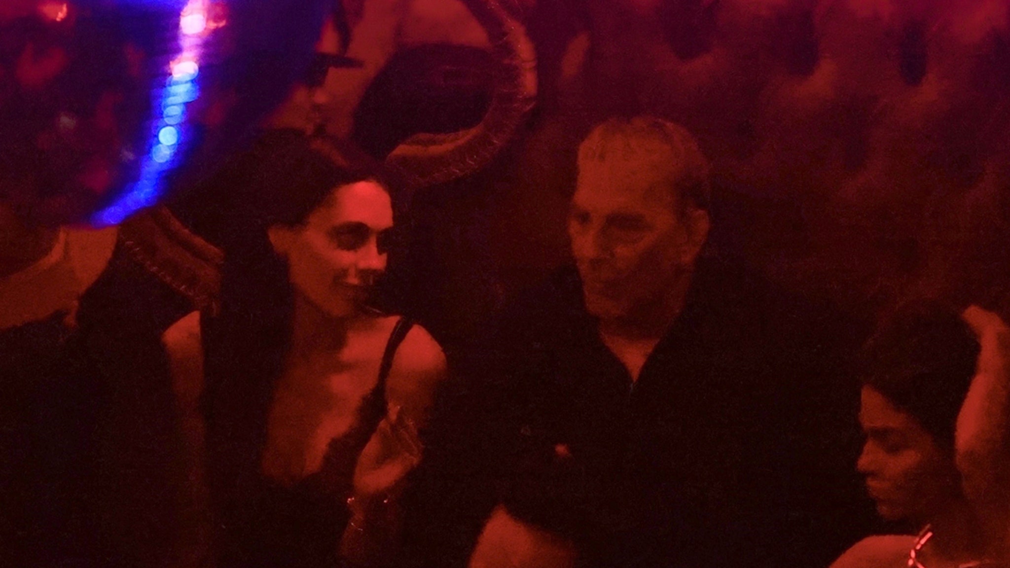 Kevin Costner Chats Up Mystery Woman at Raspoutine Night Club