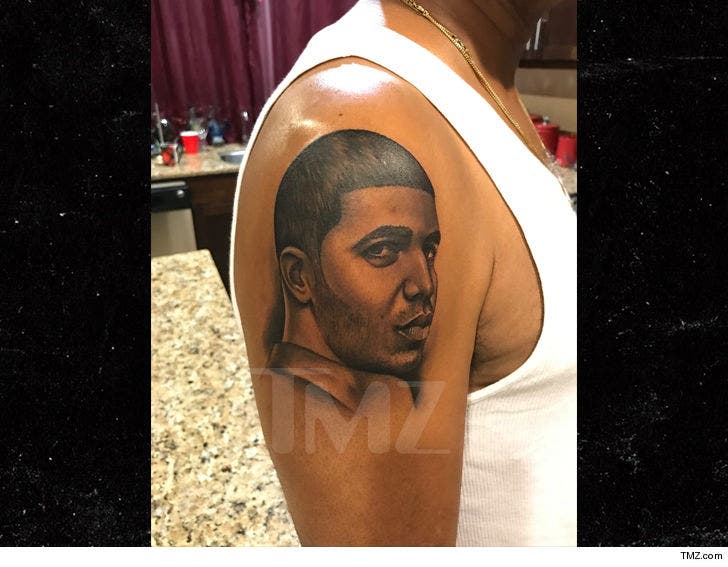 Drake teases his dad about the arm tattoo he got of the rappers face back  in 2017  Daily Mail Online