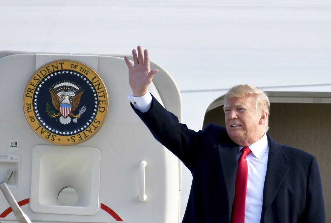 President Donald J. Trump waving from the steps of Air Force One after landing at Selfridge Air National Guard Base, Michigan, April 28, 2018.