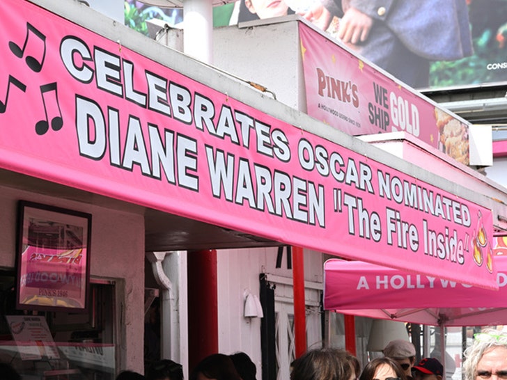 Dianne Warren appears with the vegan hot dog named after her at Pink's Hot Dogs