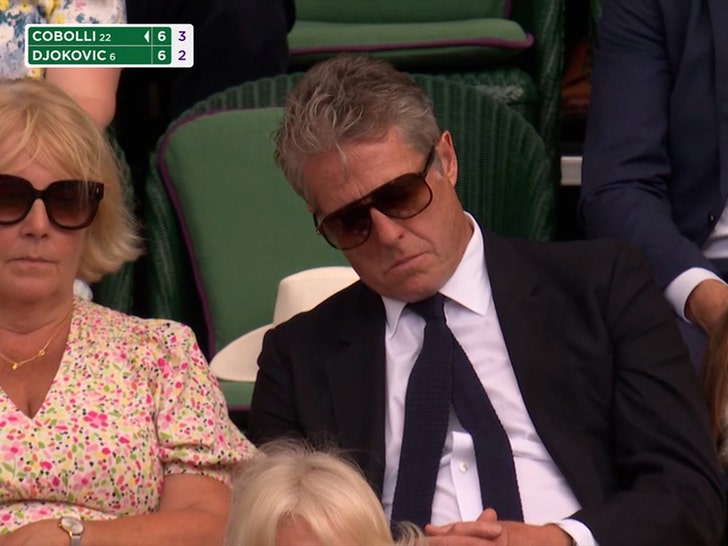 hugh grant sleeping at tennis match 1