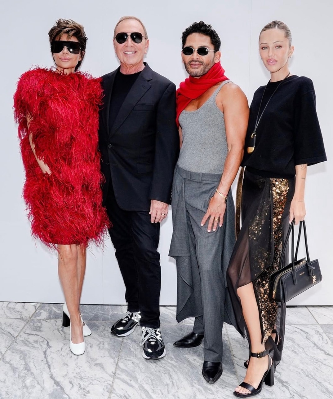 The Lions Delilah Belle and Lisa Rinna joined Issac Boots and Michael Kors at the designer's NYFW show in NYC on September 11.