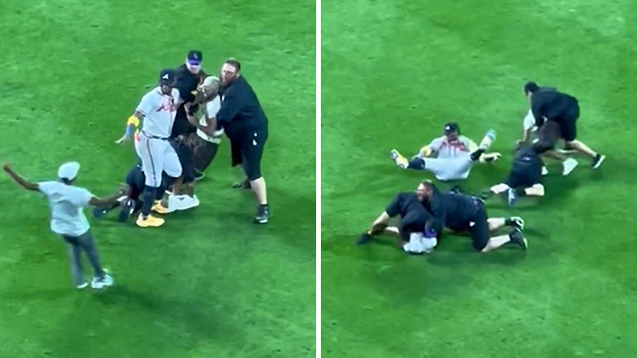 Atlanta Braves' Ronald Acuña Jr. knocked to the ground after two