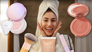 Woman In The Bathroom Surrounded By Tarte Beauty Products