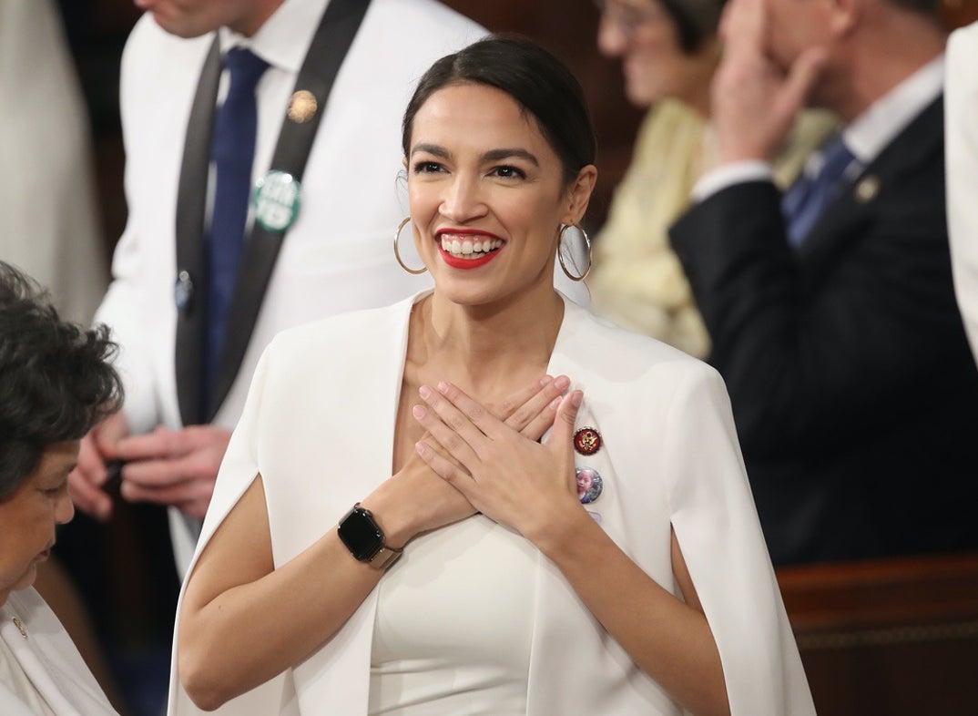 U.S. Rep. Alexandria Ocasio-Cortez (D-NY) greets fellow lawmakers ahead of the State of the Union address in the chamber of the U.S. House of Representatives on February 5, 2019.