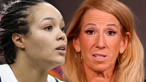 Napheesa Collier's looking concerned next to WNBA Commissioner Cathy Engelbert. The Former is wearing a white Nike basketball jersey.