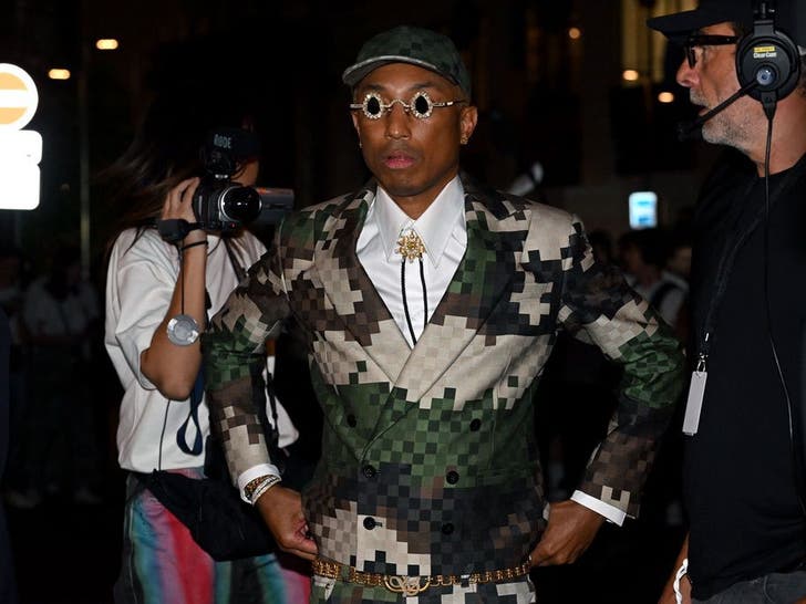 Kanye West and Pharrell Williams vibing front row at Louis