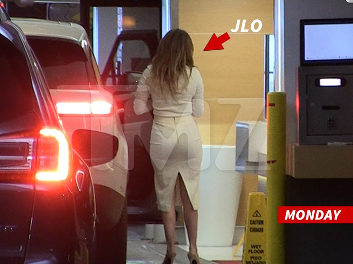 Jennifer Lopez exiting a car in a parking garage heading to Ben Affleck divorce negotiation.